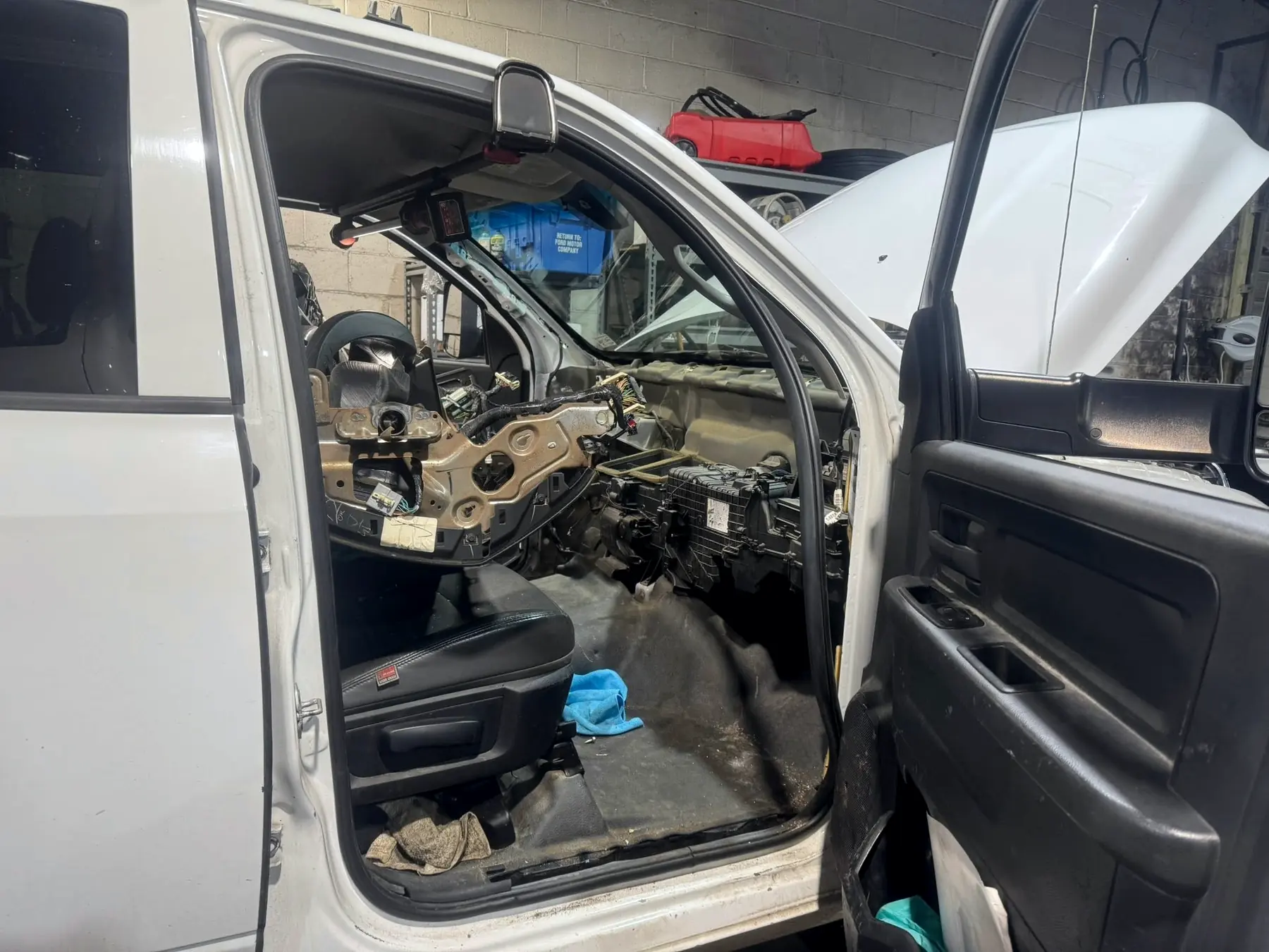 Ram cab with the dash pulled out for A/C and heater work