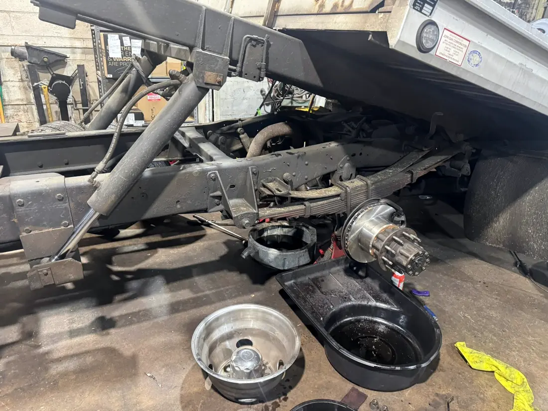 Rear axle, hub and brake drum removed from a dually