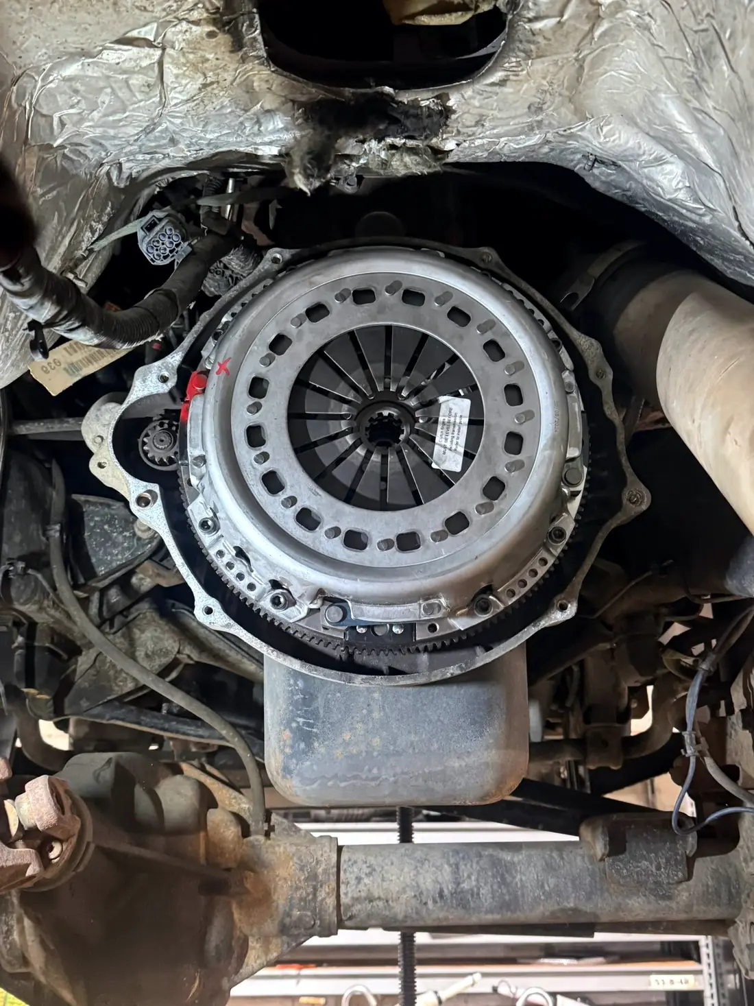 Clutch and flywheel assembly exposed with the transmission removed