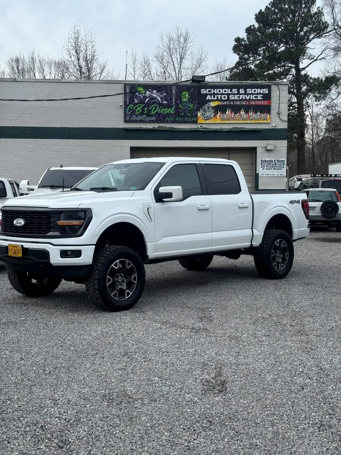 White Ford F-150 outside the CBS Diesel building