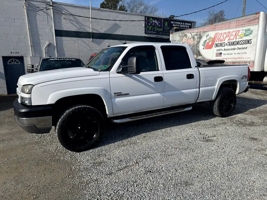 White Chevrolet Silverado 2500HD LB7 Duramax outside the shop
