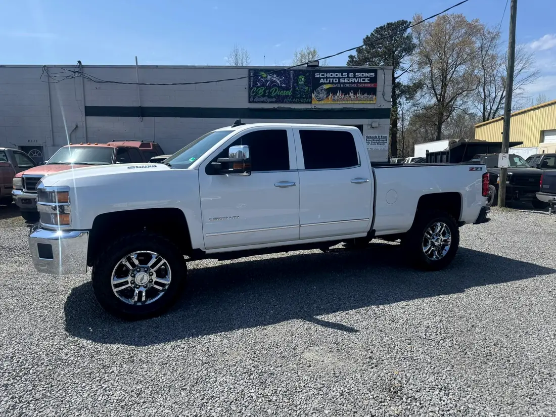 White Chevrolet Silverado 2500HD outside the shop