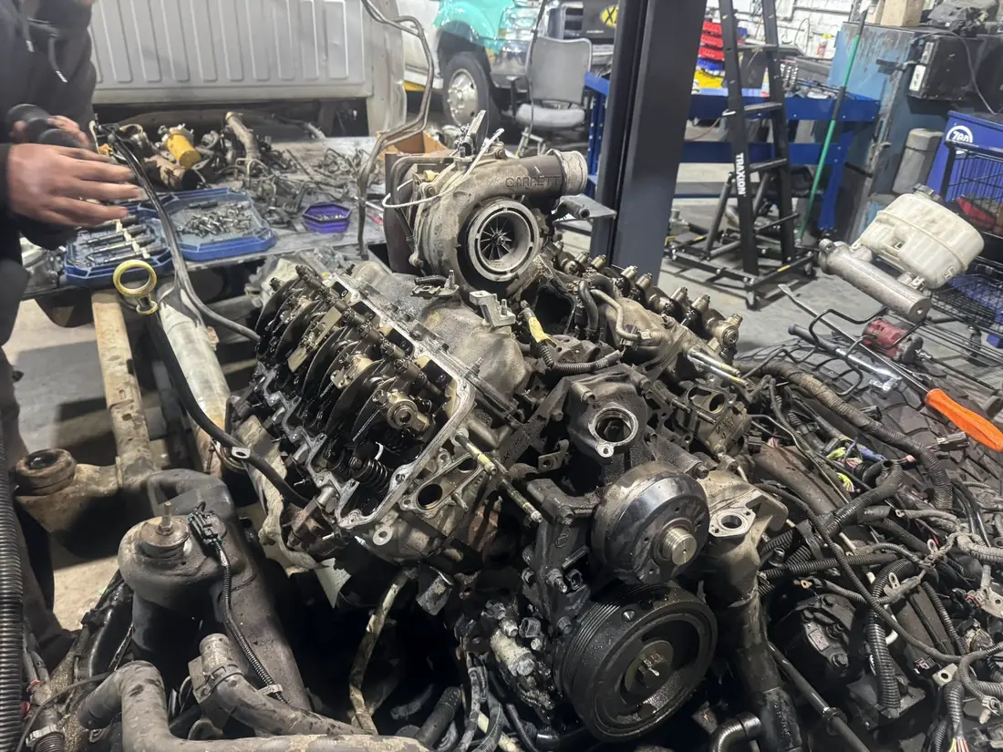 Duramax engine stripped down to the heads, turbo and injectors during teardown