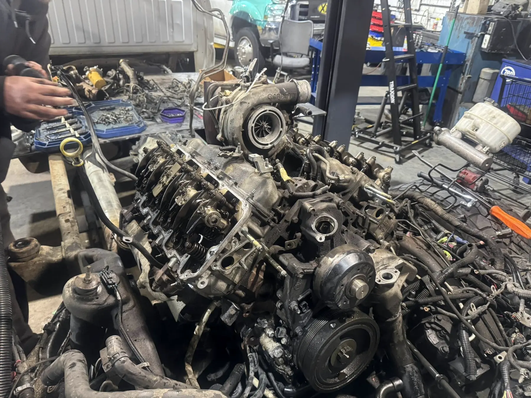 Duramax engine stripped down to the heads, turbo and injectors during teardown