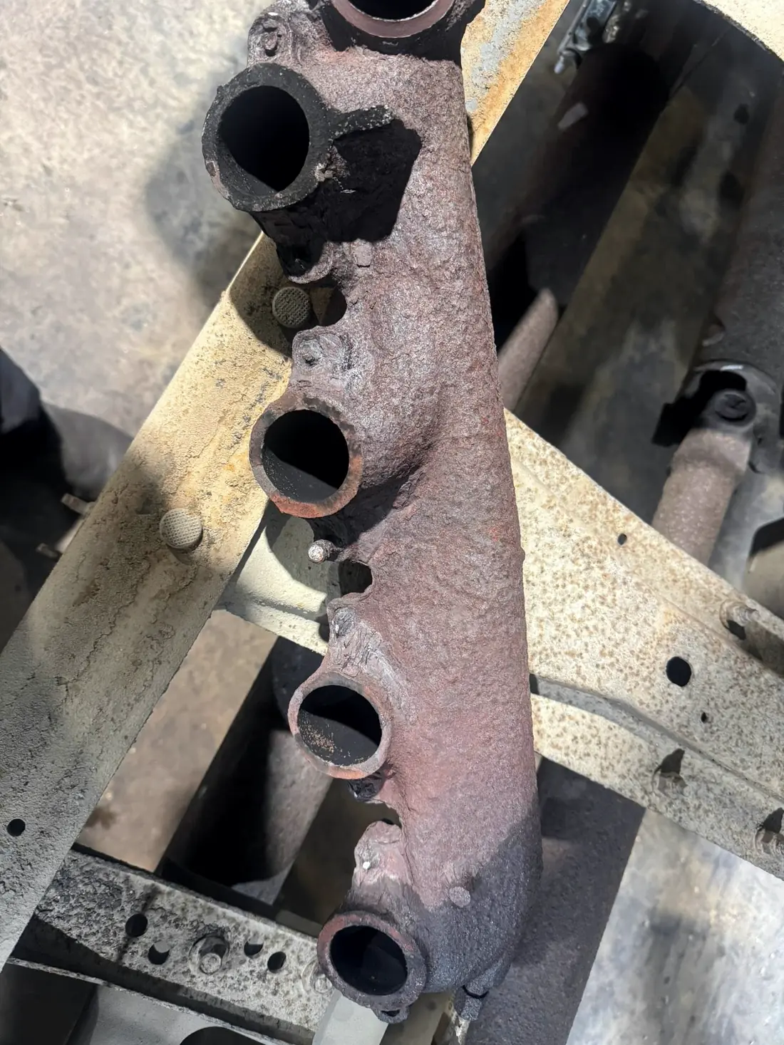 Corroded exhaust manifold removed from a diesel truck