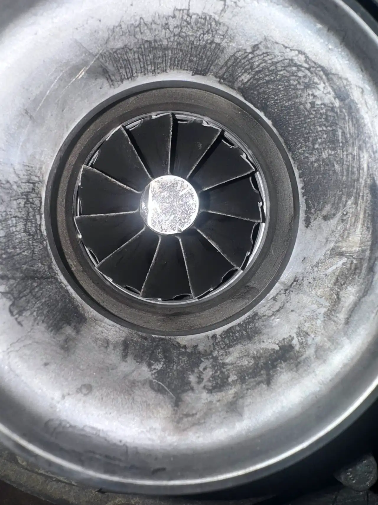 Soot-covered turbocharger compressor wheel
