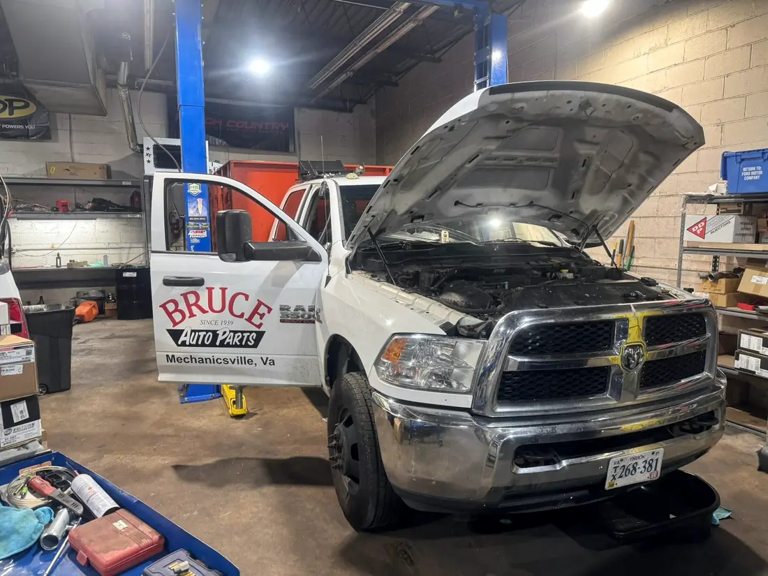 Bruce Auto Parts Ram in the bay at CBS Diesel with the hood up