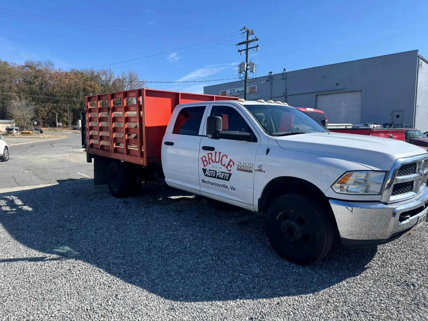 Bruce Auto Parts stake-body Ram 3500 outside the CBS Diesel shop
