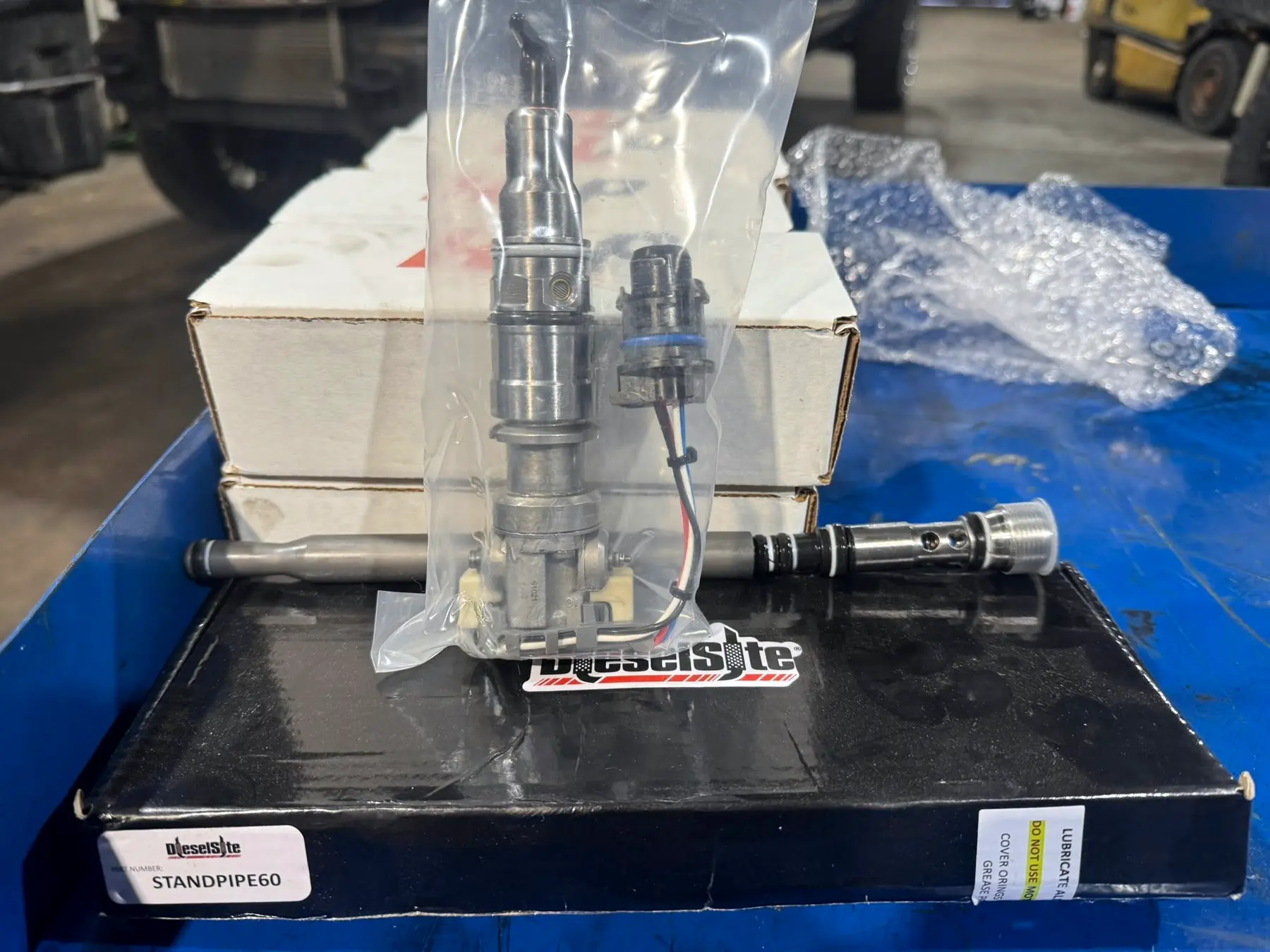 DieselSite standpipes for a 6.0 Power Stroke, still in their packaging
