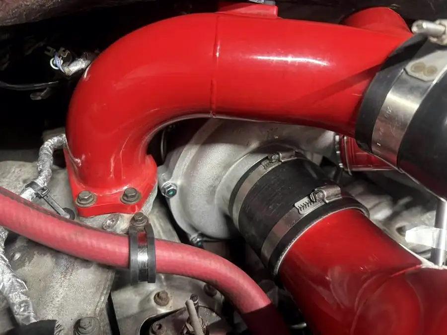 Red intercooler piping connected to the turbocharger