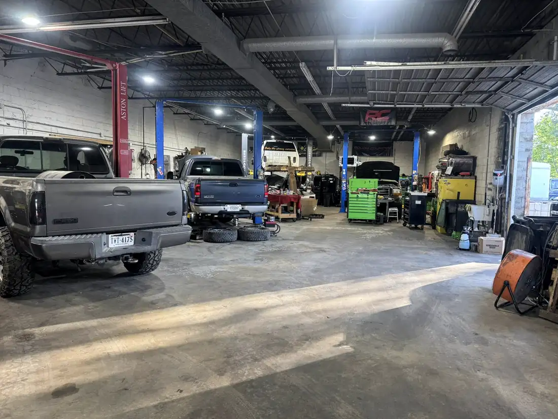 Interior of the CBS Diesel workshop showing the two-post lifts and equipment