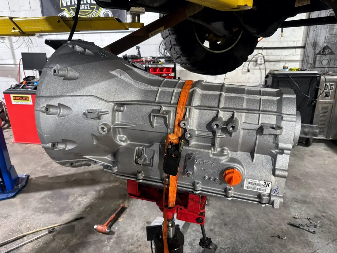 Transmission removed from a truck and supported on a jack