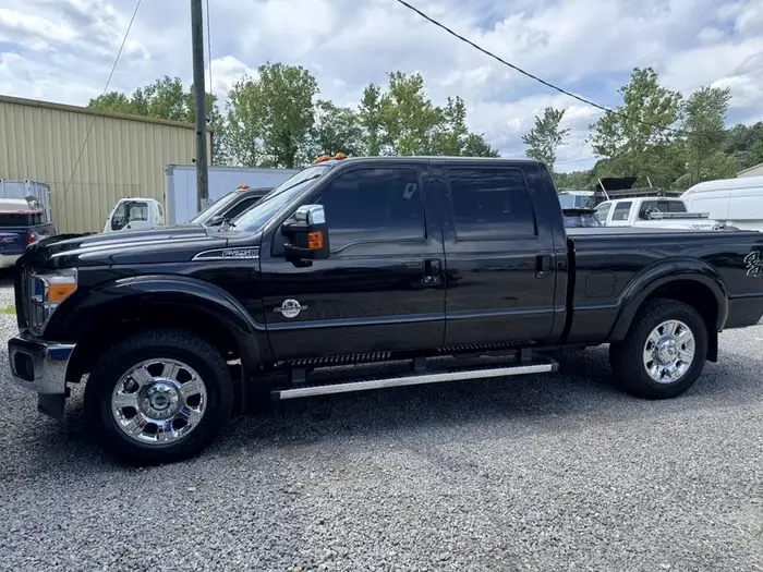 Black Ford F-250 Super Duty outside the shop