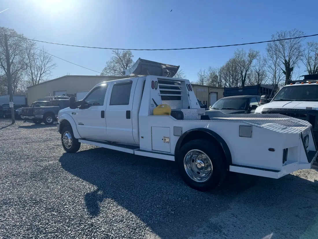 White Ford F-550 hauler outside the shop