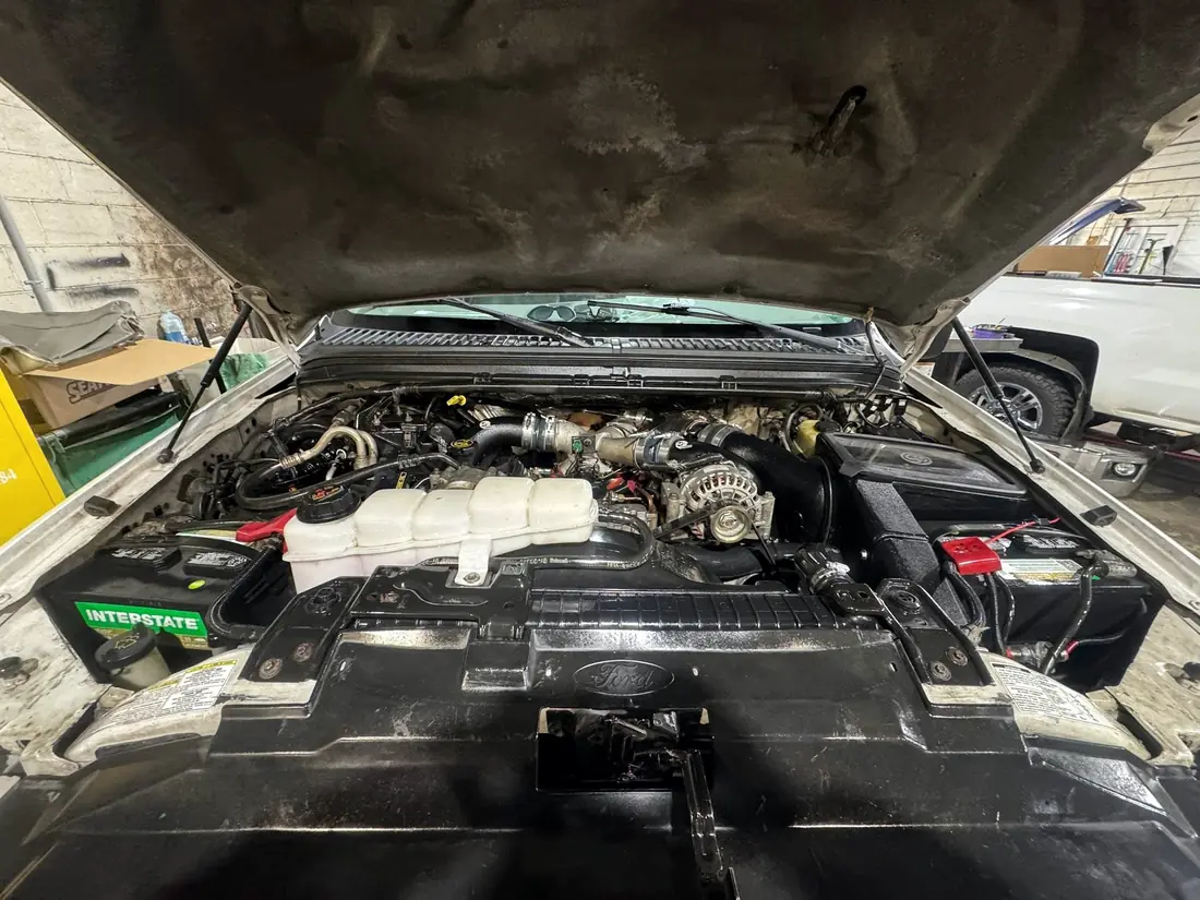 7.3 Power Stroke engine bay with a new battery fitted