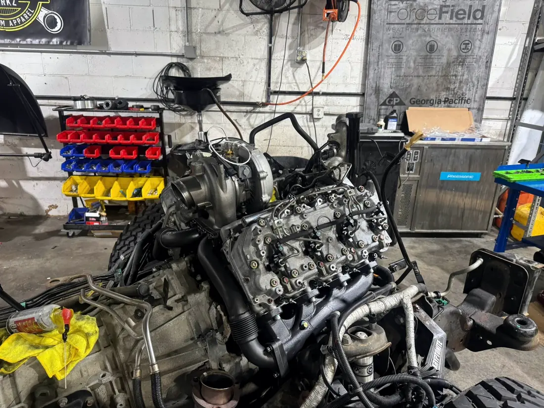 Diesel engine removed and set down on the shop floor