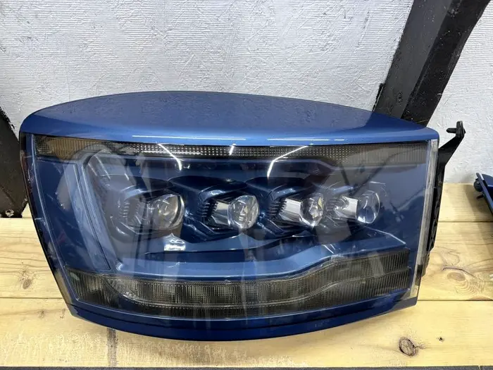 Headlight assembly finished in body color on the bench