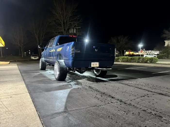 Blue Ram on polished wheels photographed outside at night