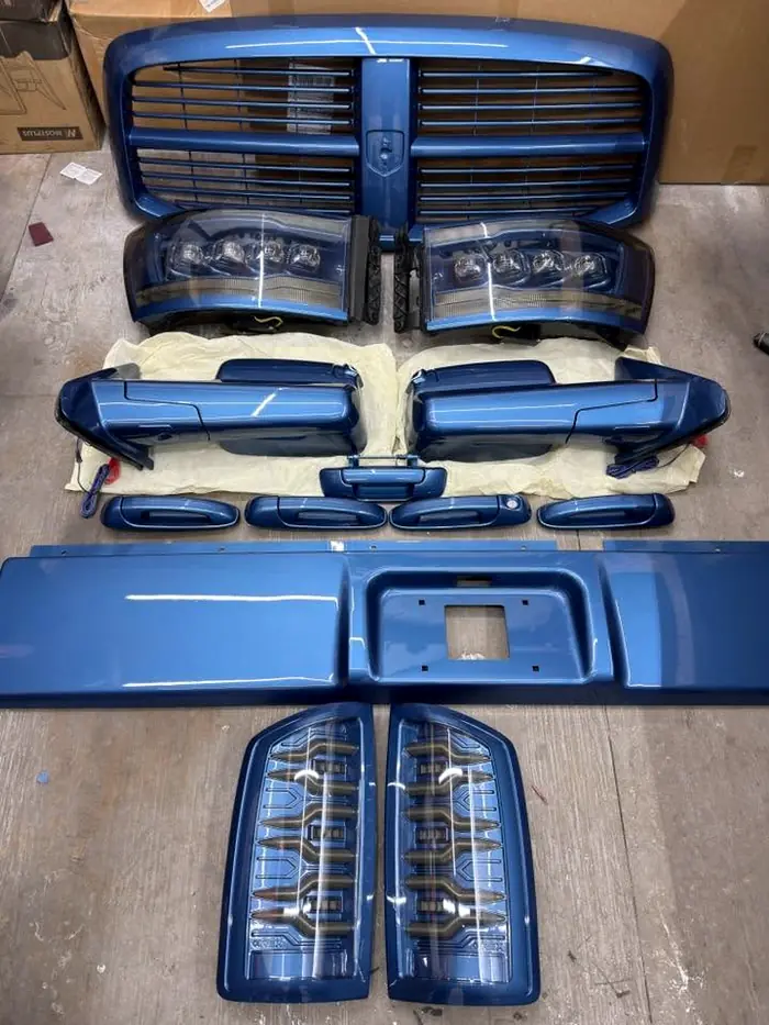 Grille and headlight parts finished in body color