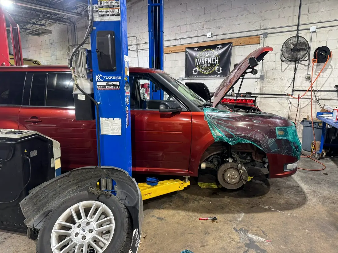 Vehicle masked off on the lift in the CBS Diesel bay