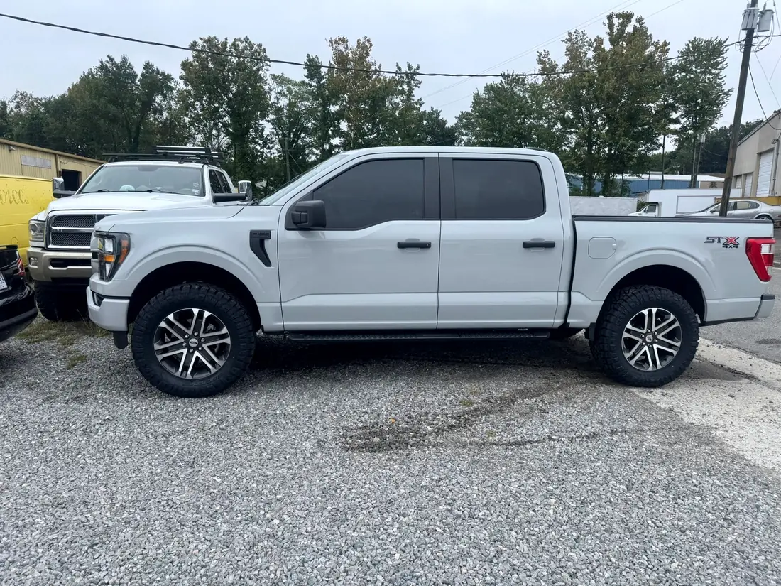 White Ford F-150 STX outside the shop