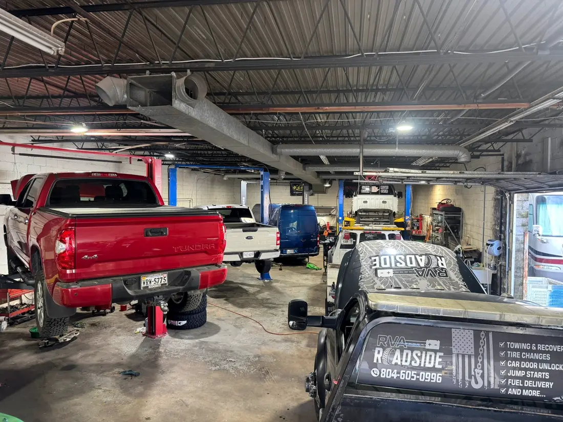 CBS Diesel shop floor with a red pickup and a service truck