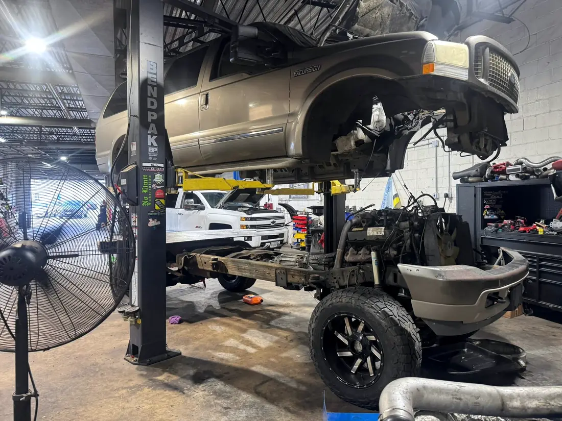 Ford Excursion with the body lifted off the chassis