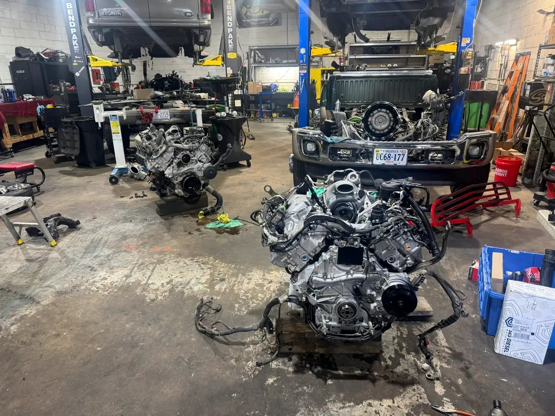 Two diesel engines on carts on the CBS Diesel shop floor