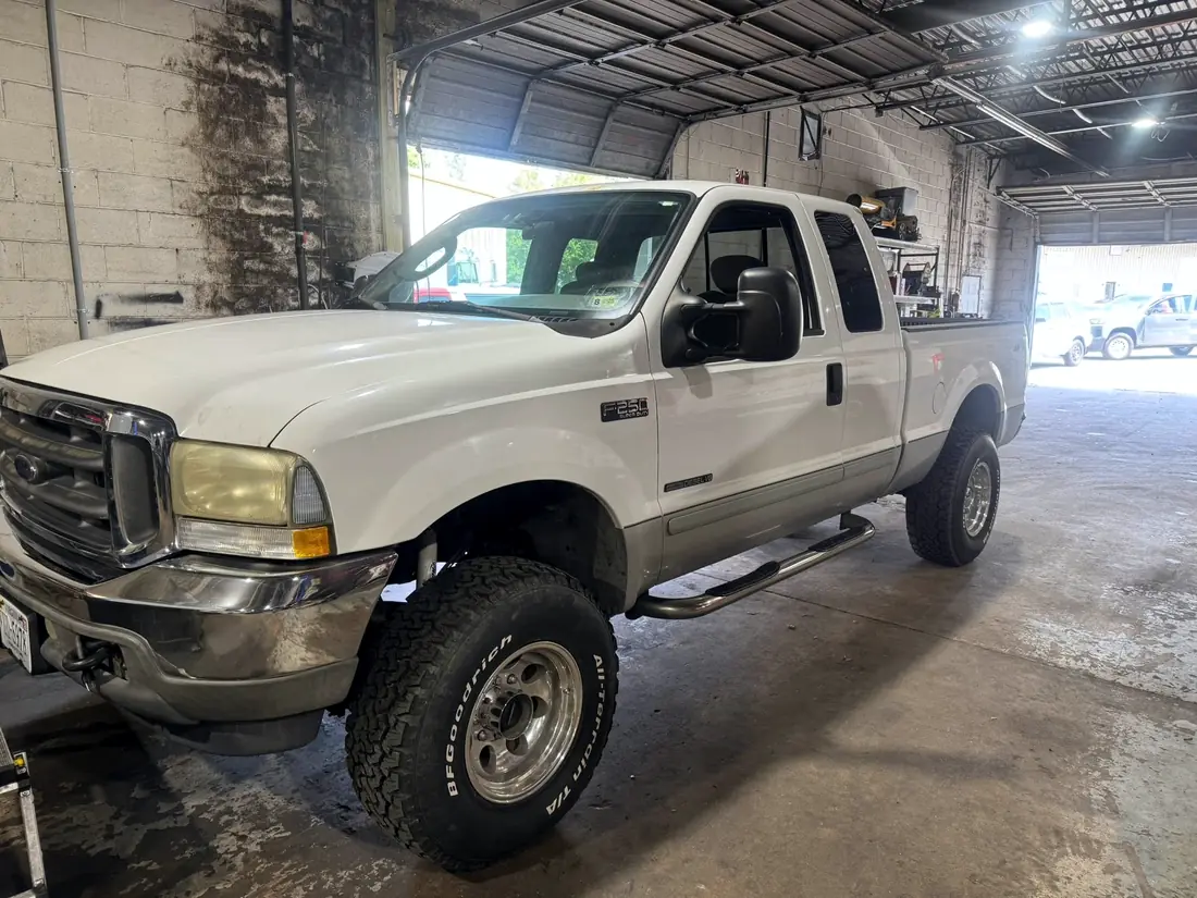 White Ford F-250 Super Duty in the CBS Diesel bay