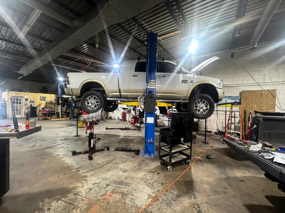 White Ram 2500 raised on the two-post lift