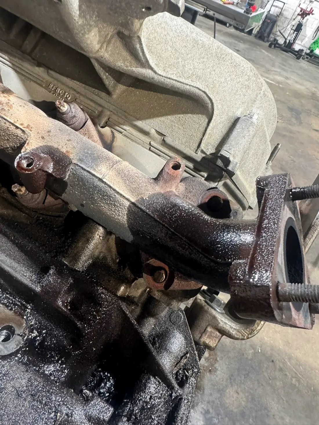 Exhaust manifold and up-pipe removed from the engine