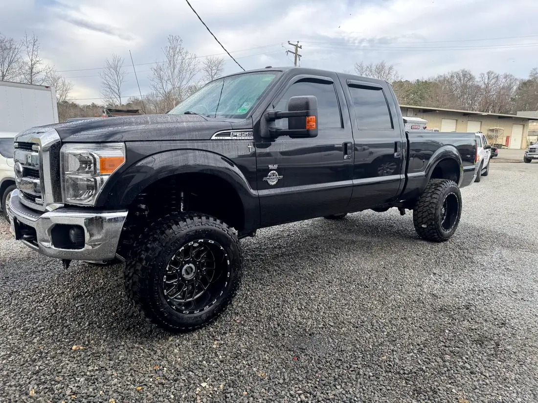 Charcoal Ford F-250 on aftermarket wheels after a wheel and tire fitment