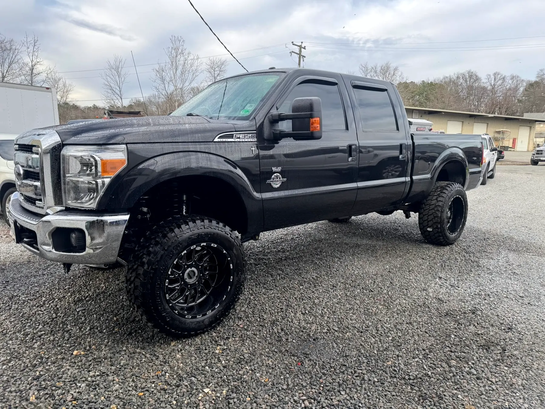 Charcoal Ford F-250 on aftermarket wheels after a wheel and tire fitment